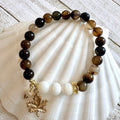 67b9ea7598f8a707689a5b69_8mm-gemstone-charm-brown_1789427979684.jpg