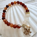 67b9ea7598f8a707689a5b69_8mm-gemstone-charm-orange_1789428106516.jpg