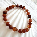 67b9ea7598f8a707689a5b69_8mm-gemstone-rosegold-fire-agate_1789427555304.jpg