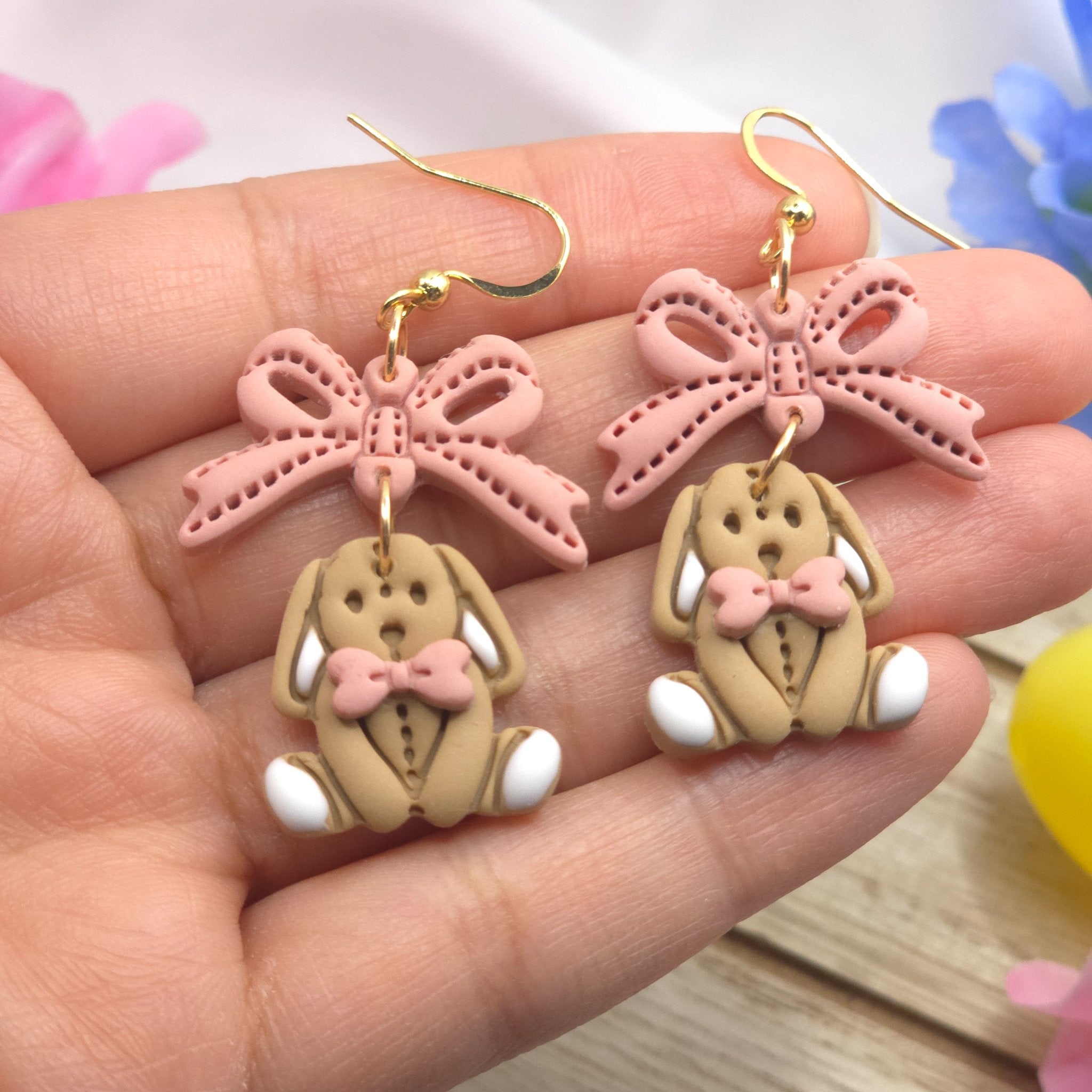67b9ea7598f8a707689a5b69_bunnyandbowdangleearring7_1778731446050.jpg
