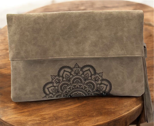 67b9ea7598f8a707689a5b69_clutch-bag-with-madalla-engraving_1754440199249.jpeg