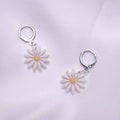67b9ea7598f8a707689a5b69_daisyhuggiedropearrings_1779340072259.jpg