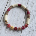 67b9ea7598f8a707689a5b69_heishi-red-and-beige_1789428400441.jpg