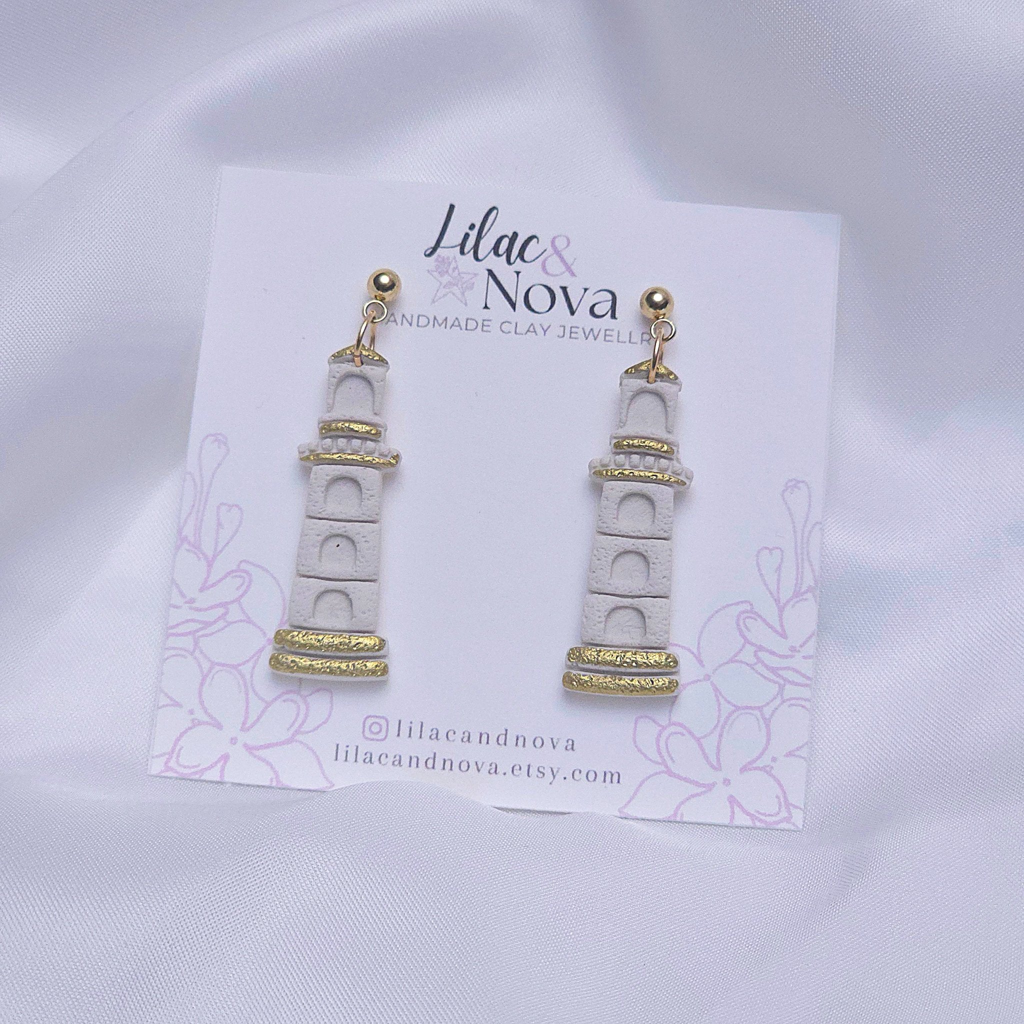 67b9ea7598f8a707689a5b69_lighthousegoldaccentdropearring_1779066953868.jpg