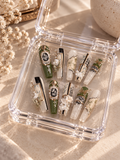 67b9ea7598f8a707689a5b69_luxurious-emerald-and-ivory-nail-art-display_1793118958485.png