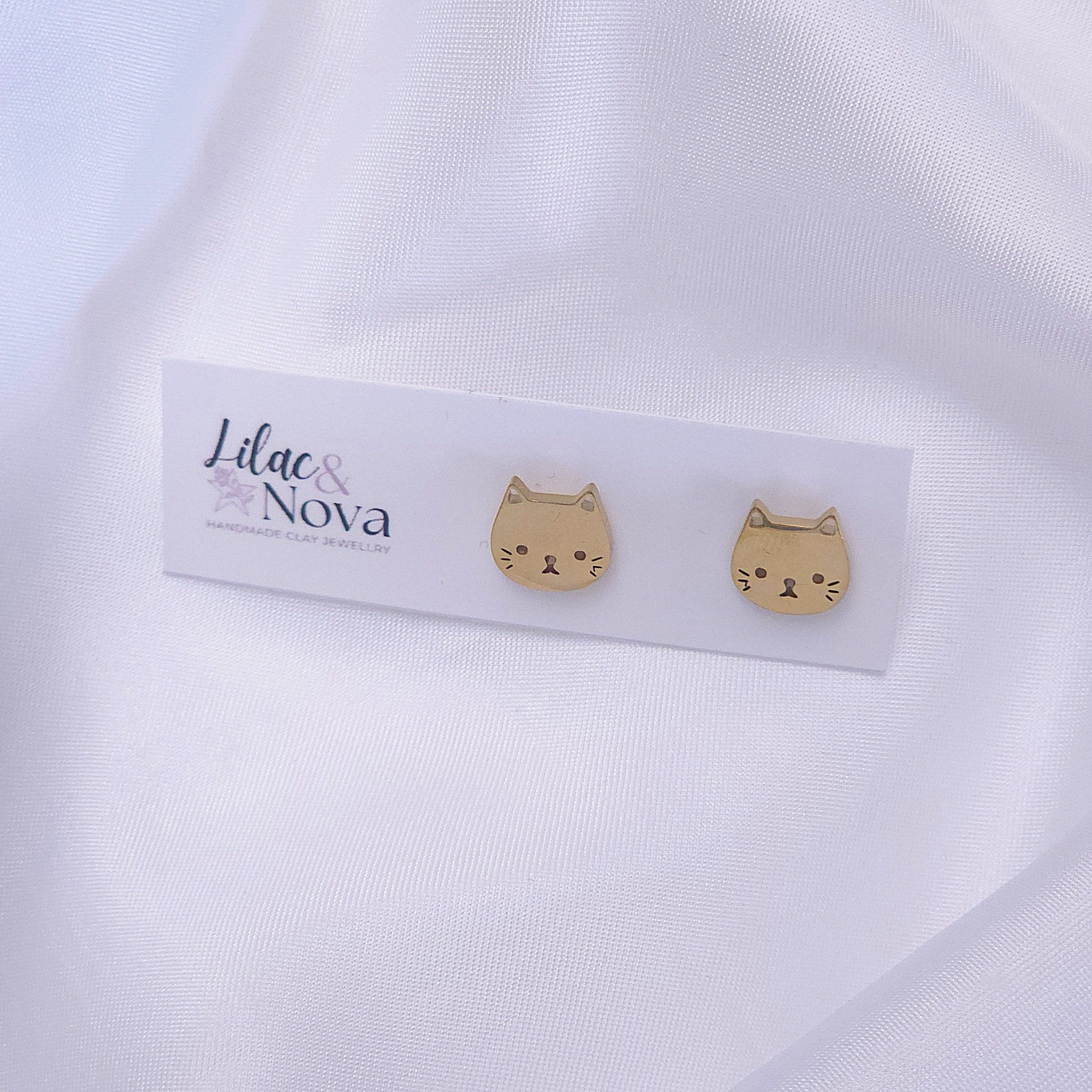 67b9ea7598f8a707689a5b69_metalfacecatstud-gold_1777780289007.jpg