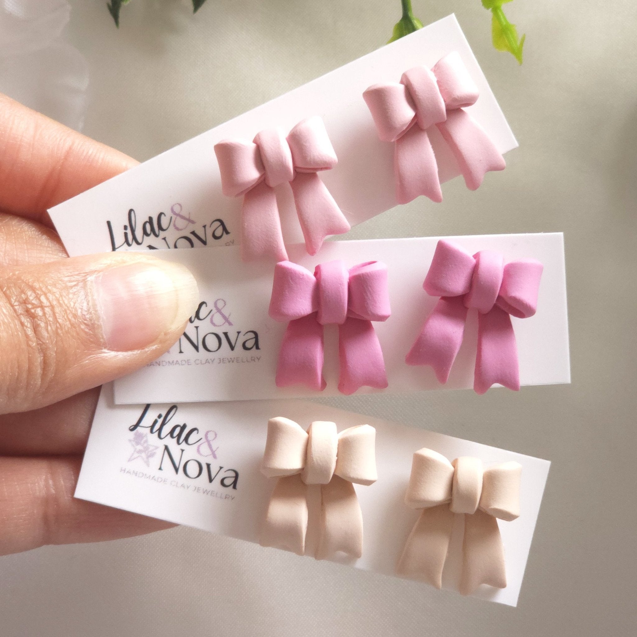 67b9ea7598f8a707689a5b69_pinkpetitebowstud-4_1770398042777.jpg