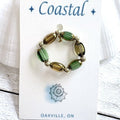 67b9ea7598f8a707689a5b69_ring-green-and-gold_1789444425262.jpg