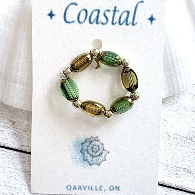 67b9ea7598f8a707689a5b69_ring-green-and-gold_1789444425262.jpg
