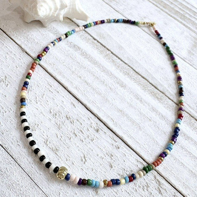 67b9ea7598f8a707689a5b69_seed-bead-gold-ball-fall_1789418174756.jpg