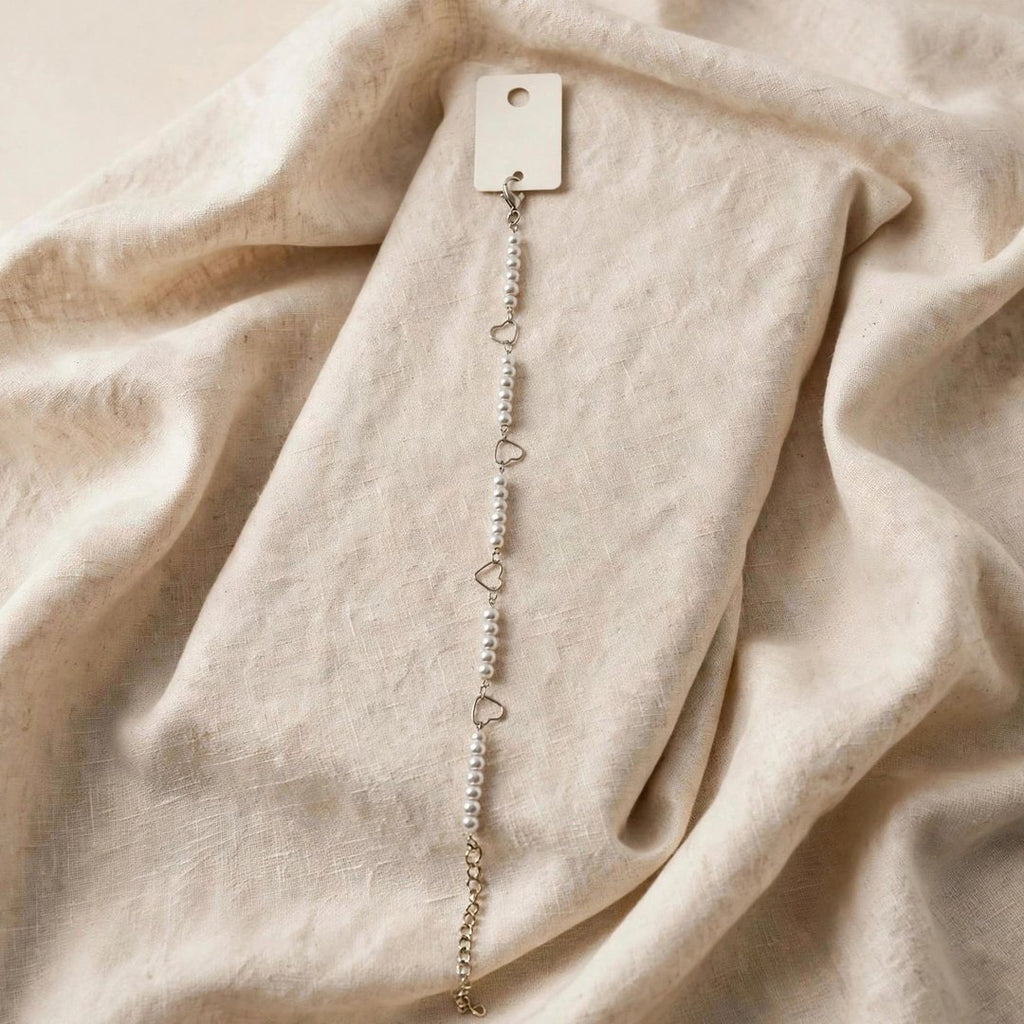 67b9ea7598f8a707689a5b69_silver-heart-pearl-bracelet-1080_1789259442249.jpg