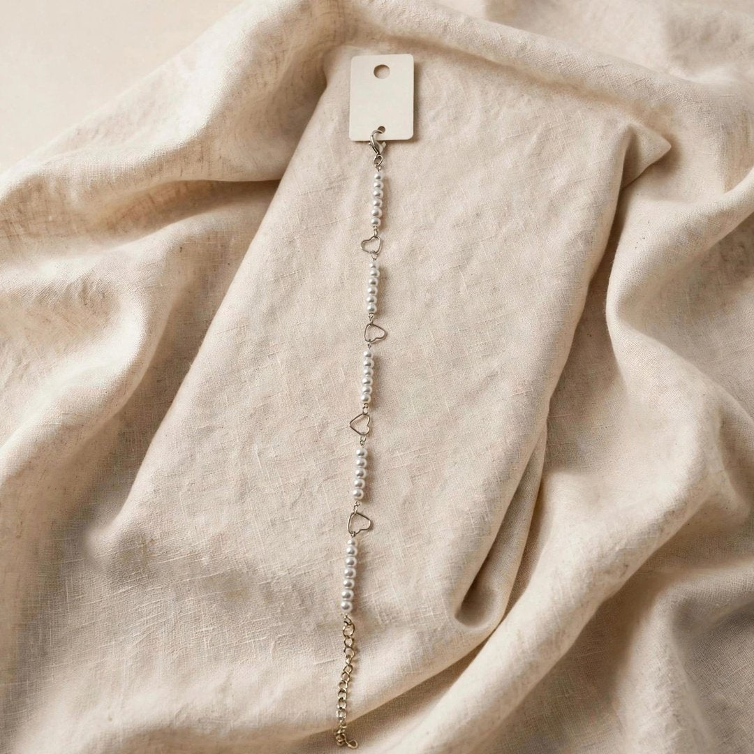 67b9ea7598f8a707689a5b69_silver-heart-pearl-bracelet-1080_1789259442249.jpg