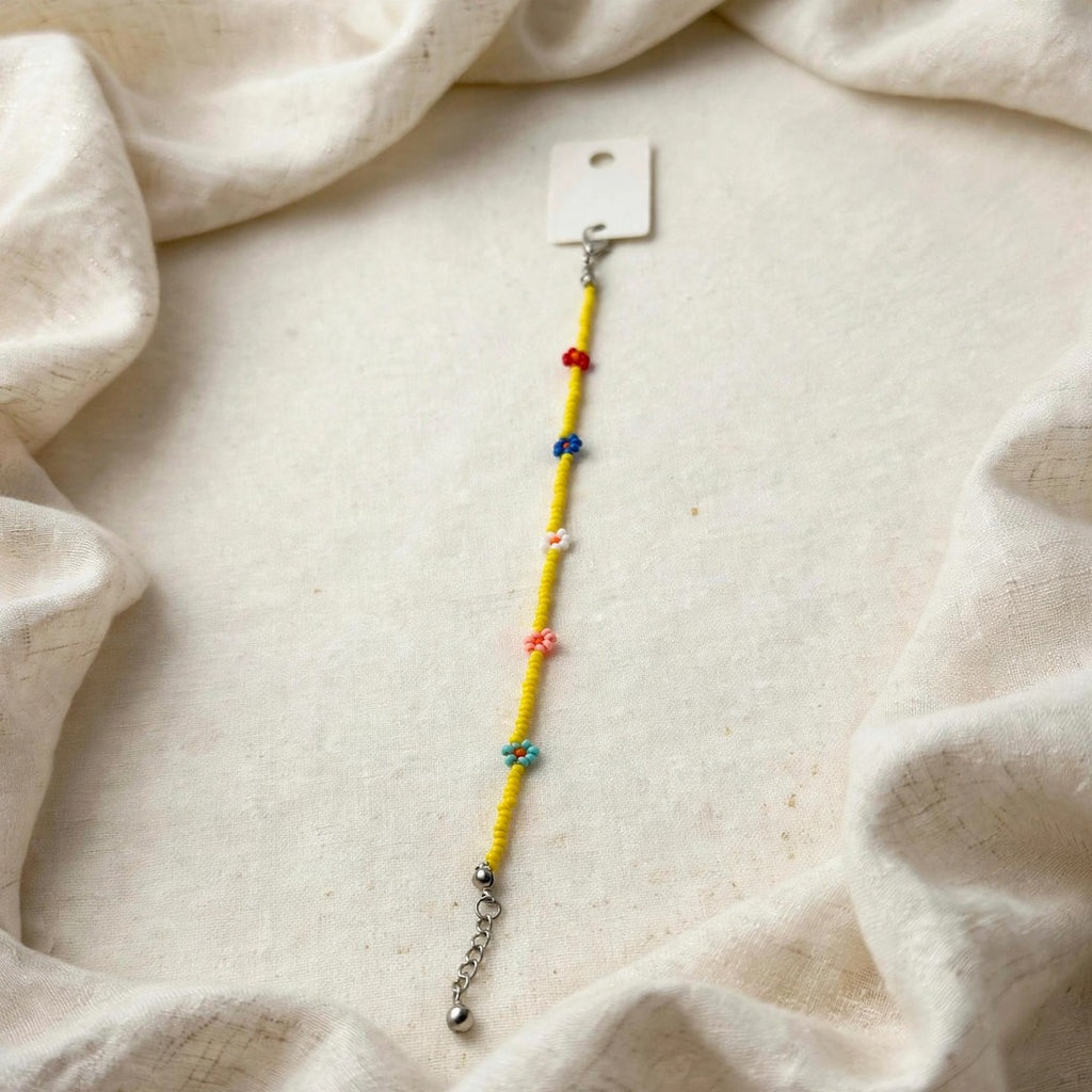 67b9ea7598f8a707689a5b69_yellow-flower-bracelet-1080_1789261931325.jpeg